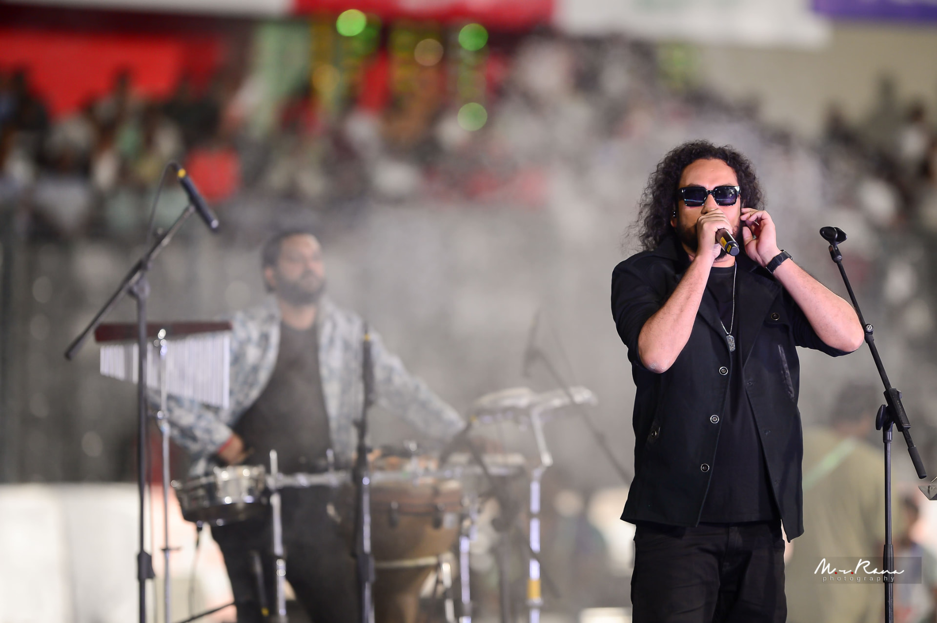 Muttaque Hasib performing with his band behind him
